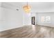 Bright living room featuring modern flooring and a stylish light fixture at 5537 Sentinel Bridge St, Las Vegas, NV 89130