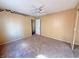 Bedroom featuring neutral carpet, ceiling fan, a window, and closet space at 5576 W Rochelle Ave # 38B, Las Vegas, NV 89103