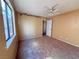 Bedroom featuring neutral carpet, ceiling fan, a window, and closet space at 5576 W Rochelle Ave # 38B, Las Vegas, NV 89103