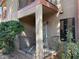 Apartment exterior with stucco siding, covered patio, and wrought iron fence at 5576 W Rochelle Ave # 38B, Las Vegas, NV 89103