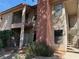 Apartment exterior featuring stairs leading to the entrance, balcony, and stucco siding at 5576 W Rochelle Ave # 38B, Las Vegas, NV 89103