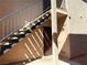 Apartment exterior with stairs leading to the entrance and stucco siding at 5576 W Rochelle Ave # 38B, Las Vegas, NV 89103