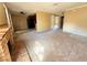 Large living room with a fireplace and open access to the kitchen and dining areas at 5576 W Rochelle Ave # 38B, Las Vegas, NV 89103