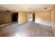 Open floor plan featuring carpeted living area and view of the adjacent kitchen at 5576 W Rochelle Ave # 38B, Las Vegas, NV 89103