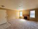 Inviting living room featuring a fireplace, neutral carpet, and bright natural light at 5576 W Rochelle Ave # 38B, Las Vegas, NV 89103