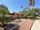 Inviting pool entrance with lush landscaping, palm trees, and well-maintained shrubbery on a sunny day at 5576 W Rochelle Ave # 38B, Las Vegas, NV 89103