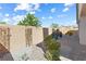 This landscaped backyard features xeriscape, a block wall, and covered outdoor living space at 6033 Torciano St, North Las Vegas, NV 89081