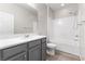 Bright bathroom with tub shower, vanity, and updated fixtures at 6033 Torciano St, North Las Vegas, NV 89081