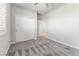 Relaxing bedroom with soft carpet, a ceiling fan, closet, and a bright window at 6033 Torciano St, North Las Vegas, NV 89081