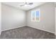 Comfortable bedroom featuring a ceiling fan, plush carpet, and a window with shutters at 6033 Torciano St, North Las Vegas, NV 89081