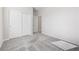 This carpeted bedroom features neutral walls, a double door closet, and a door to another room at 6033 Torciano St, North Las Vegas, NV 89081