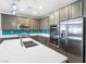 Well-equipped kitchen featuring stainless steel appliances and plenty of cabinet space at 6033 Torciano St, North Las Vegas, NV 89081