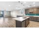 Open-concept kitchen seamlessly connecting to the living area, ideal for entertaining and Gathering gatherings at 6033 Torciano St, North Las Vegas, NV 89081