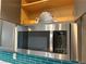 The stainless steel microwave sits above the cooktop providing a modern design at 6033 Torciano St, North Las Vegas, NV 89081