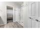 Bright main bathroom featuring glass shower enclosure and access to a walk-in closet at 6033 Torciano St, North Las Vegas, NV 89081