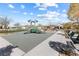 This community park features playground equipment, benches, plenty of grass, and trees at 6033 Torciano St, North Las Vegas, NV 89081