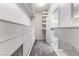 Bright walk-in closet features custom shelving and drawers providing ample storage space at 6033 Torciano St, North Las Vegas, NV 89081