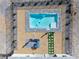 Overhead view of the backyard featuring a rectangular pool and patio with outdoor seating at 6101 Cavalry Trl, Pahrump, NV 89060