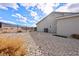 Backyard showcasing minimal landscaping, a black metal fence, and mountain views at 6101 Cavalry Trl, Pahrump, NV 89060