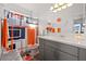 Bathroom featuring a grey vanity and a shower with orange and grey patterns at 6101 Cavalry Trl, Pahrump, NV 89060