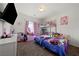 bedroom with carpet, a window, pink curtains, a bunkbed, and colorful decorations at 6101 Cavalry Trl, Pahrump, NV 89060