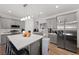 Modern kitchen with gray cabinetry, stainless steel appliances, and a spacious center island at 6101 Cavalry Trl, Pahrump, NV 89060