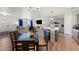 Open-concept living area with kitchen island, dining space, and living room with contemporary decor at 6101 Cavalry Trl, Pahrump, NV 89060