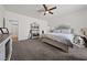 Comfortable main bedroom with a ceiling fan, carpet flooring, and a neutral color palette at 6101 Cavalry Trl, Pahrump, NV 89060
