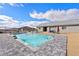 Backyard pool with beautiful hardscaping and views of the mountains on a sunny day at 6101 Cavalry Trl, Pahrump, NV 89060