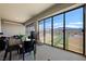 Enclosed sun room with large screened-in glass doors opening to the pool, with views of the mountains at 6101 Cavalry Trl, Pahrump, NV 89060