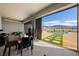 Enclosed sun room with large glass doors opening to the pool, with views of the mountains at 6101 Cavalry Trl, Pahrump, NV 89060