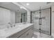 Modern bathroom featuring double sinks, a glass shower and modern fixtures at 6109 W Oakey Blvd # C, Las Vegas, NV 89146