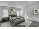 Well-lit bedroom featuring modern decor, recessed lighting, and two large windows at 6109 W Oakey Blvd # C, Las Vegas, NV 89146