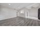 Bright living room featuring a ceiling fan and a small kitchen visible through an archway at 6109 W Oakey Blvd # C, Las Vegas, NV 89146