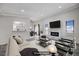 Bright living room featuring a fireplace, wood floors, and plenty of natural light at 6109 W Oakey Blvd # C, Las Vegas, NV 89146