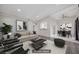 The living room features a sleek sofa, contemporary artwork, and an adjacent dining area for modern living at 6109 W Oakey Blvd # C, Las Vegas, NV 89146