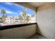Picturesque patio view with lush palm trees, scenic landscaping, and clear blue skies at 6109 W Oakey Blvd # C, Las Vegas, NV 89146