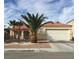 Charming single-story home featuring a well-manicured front yard with mature palm trees and a two-car garage at 6119 Magic Mesa St, North Las Vegas, NV 89031