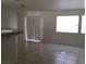 Bright living space featuring tiled floors and plenty of natural light streaming in from the windows at 6119 Magic Mesa St, North Las Vegas, NV 89031