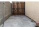 Small side yard featuring a metal and wood gate and concrete flooring at 6119 Magic Mesa St, North Las Vegas, NV 89031