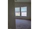 Bedroom featuring carpet, windows with blinds, and neutral paint at 6425 Extreme Shear Ave # 101, Henderson, NV 89011
