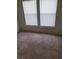 Bright bedroom with neutral carpet and natural light from two large, windowed openings at 6425 Extreme Shear Ave # 101, Henderson, NV 89011