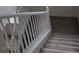 This carpeted stairway has white banisters offering both safety and classic style at 6425 Extreme Shear Ave # 101, Henderson, NV 89011