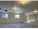 Large garage space with natural light and ample storage potential at 664 Sky Rd, Indian Springs, NV 89018