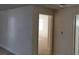 Hallway featuring neutral paint and doorway view of the bedroom at 664 Sky Rd, Indian Springs, NV 89018