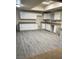 Spacious kitchen featuring ample white cabinets and countertops at 664 Sky Rd, Indian Springs, NV 89018