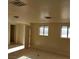 View of a living room with neutral paint and minimal fixtures at 664 Sky Rd, Indian Springs, NV 89018
