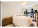 Comfortable bedroom with a cozy bed, neutral decor, and a practical setup for living or working at 6655 Little Owl Pl, North Las Vegas, NV 89084