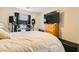 Comfortable bedroom featuring a bed, wooden dresser, and a modern entertainment setup for a relaxing ambiance at 6655 Little Owl Pl, North Las Vegas, NV 89084