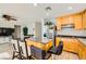 Bright kitchen with stainless steel appliances, wooden cabinets, and a center island at 6655 Little Owl Pl, North Las Vegas, NV 89084